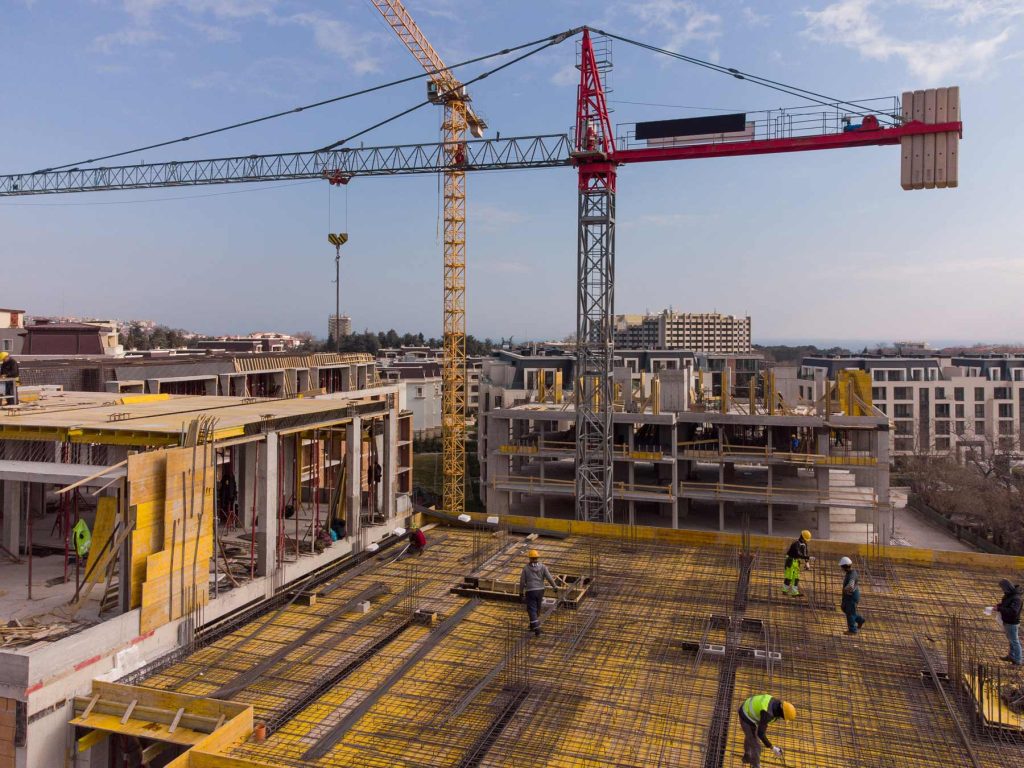 Commercial construction underway with a crane