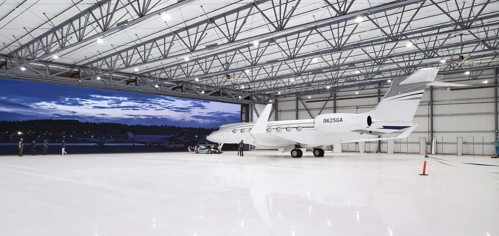 An airplane in an airport hangar